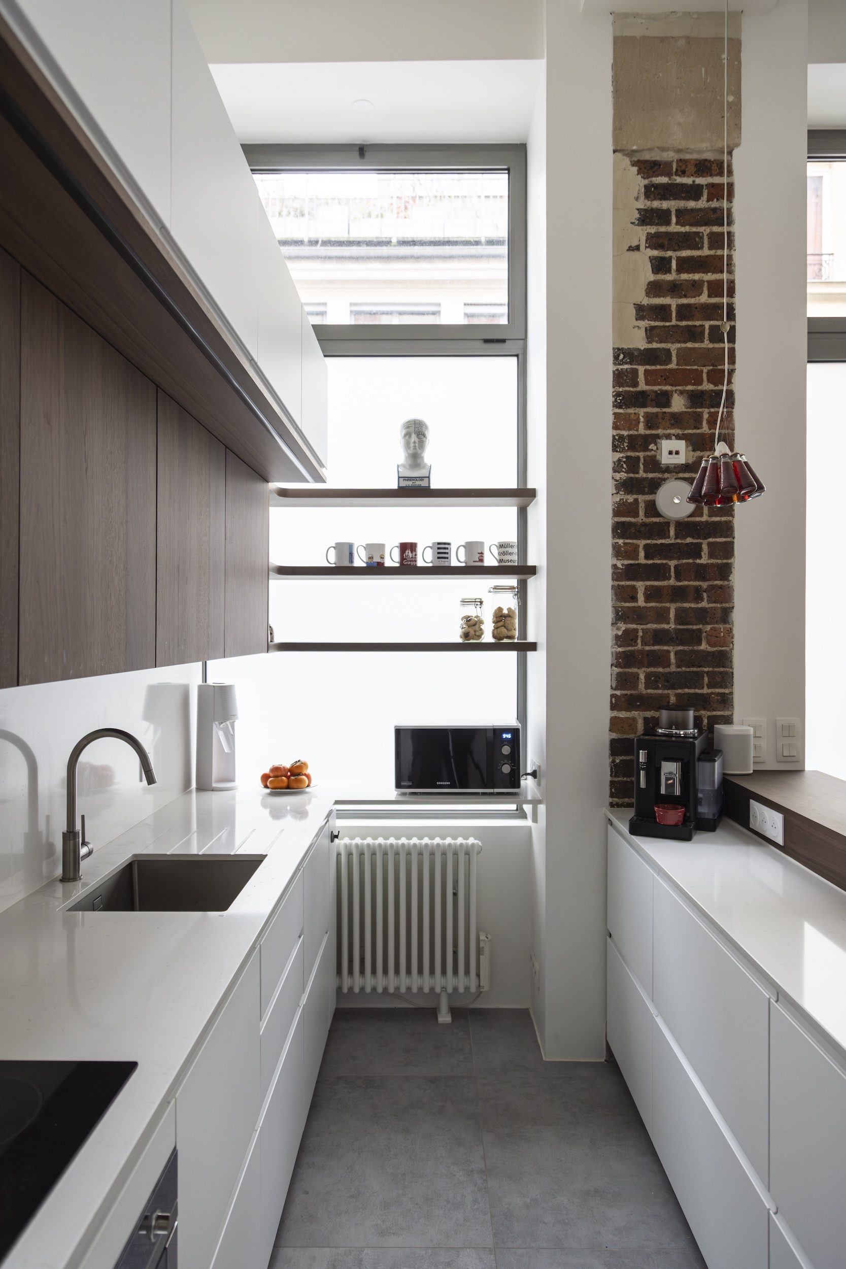 Espace repas fonctionnel près de la cuisine – Extension appartement Clichy